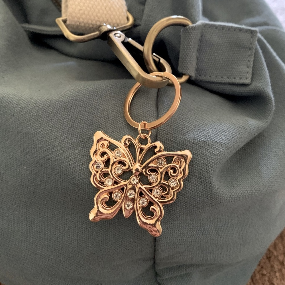 Gold-toned butterfly keychain/bag charm with rhinestones